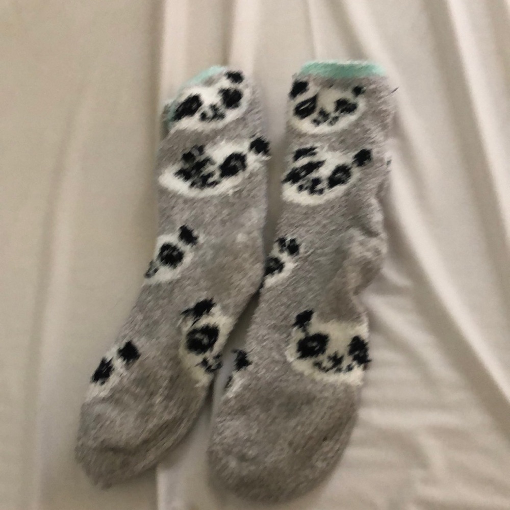 Fuzzy socks with pandas on them